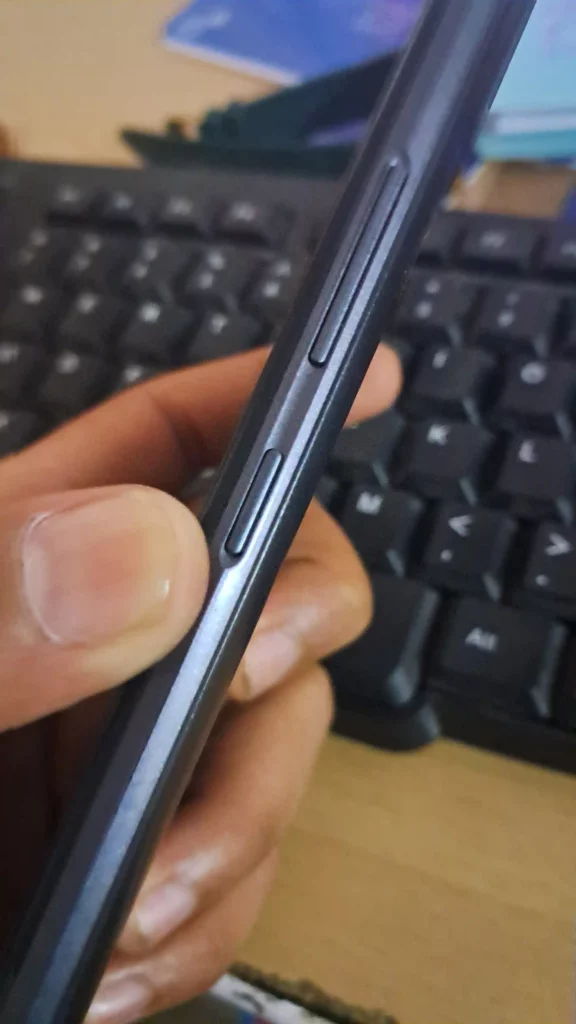 volume button with power button displayed by the side of smartphone